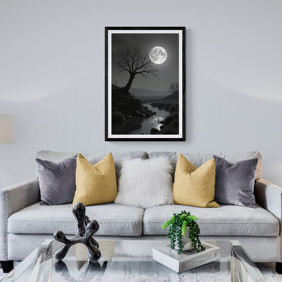 In this serene, monochromatic scene, the night is bathed in the cool, silvery light of a full moon hanging luminously in the sky. The moon, bright and full, dominates the heavens, casting an otherworldly glow over the landscape below. Its light reflects on the surface of a calm river, creating soft ripples that shimmer like liquid silver, highlighting the stillness of the moment.